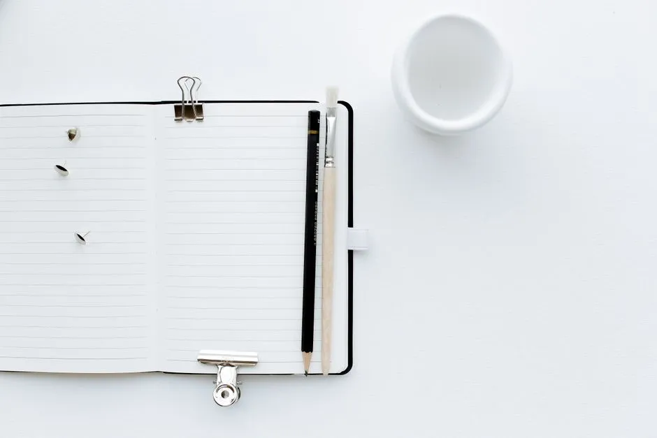 Open desk diary showing a single calendar date with pencil notes in the margin