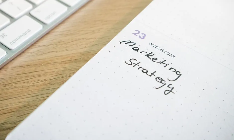 Handwritten note listing a date and a proposed correction, clipped to a printed page of entries